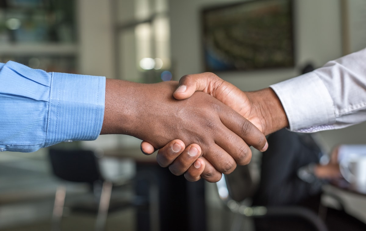 A professional business handshake in an office